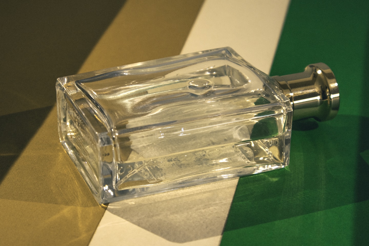 A glass bottle sitting on top of a table