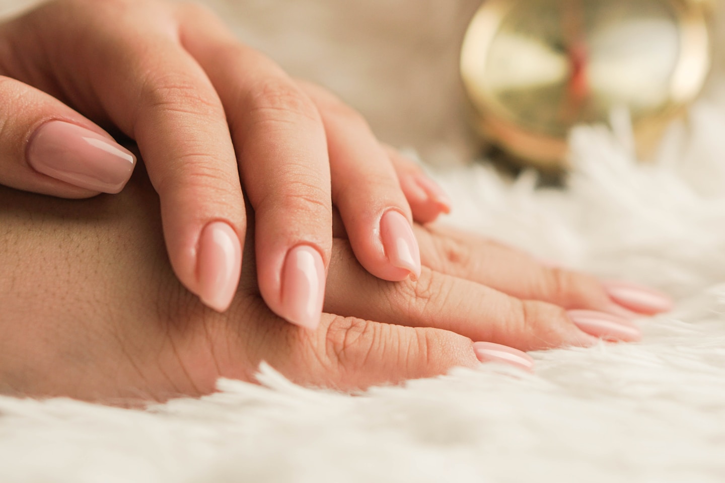 A woman posing her hands with newly polished nails.